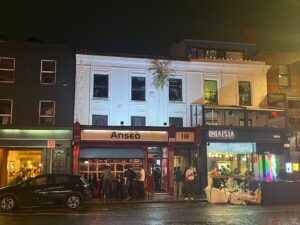 Exterior of Anseo by night