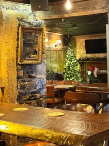 A view toward the fireplace at the Cat and Cage