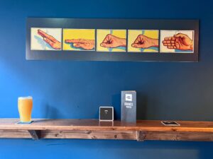 A pint at Drop Dead Twice with new wall art. You heard it, right?