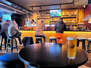 A pint of Rye River looking toward the bar at Lynott's