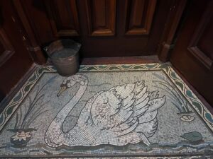 Swan mosaic outside The Swan Bar